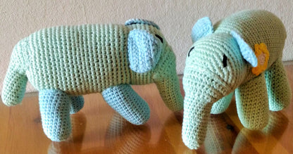 Elephant crochet plush toy home decor on wooden glass table