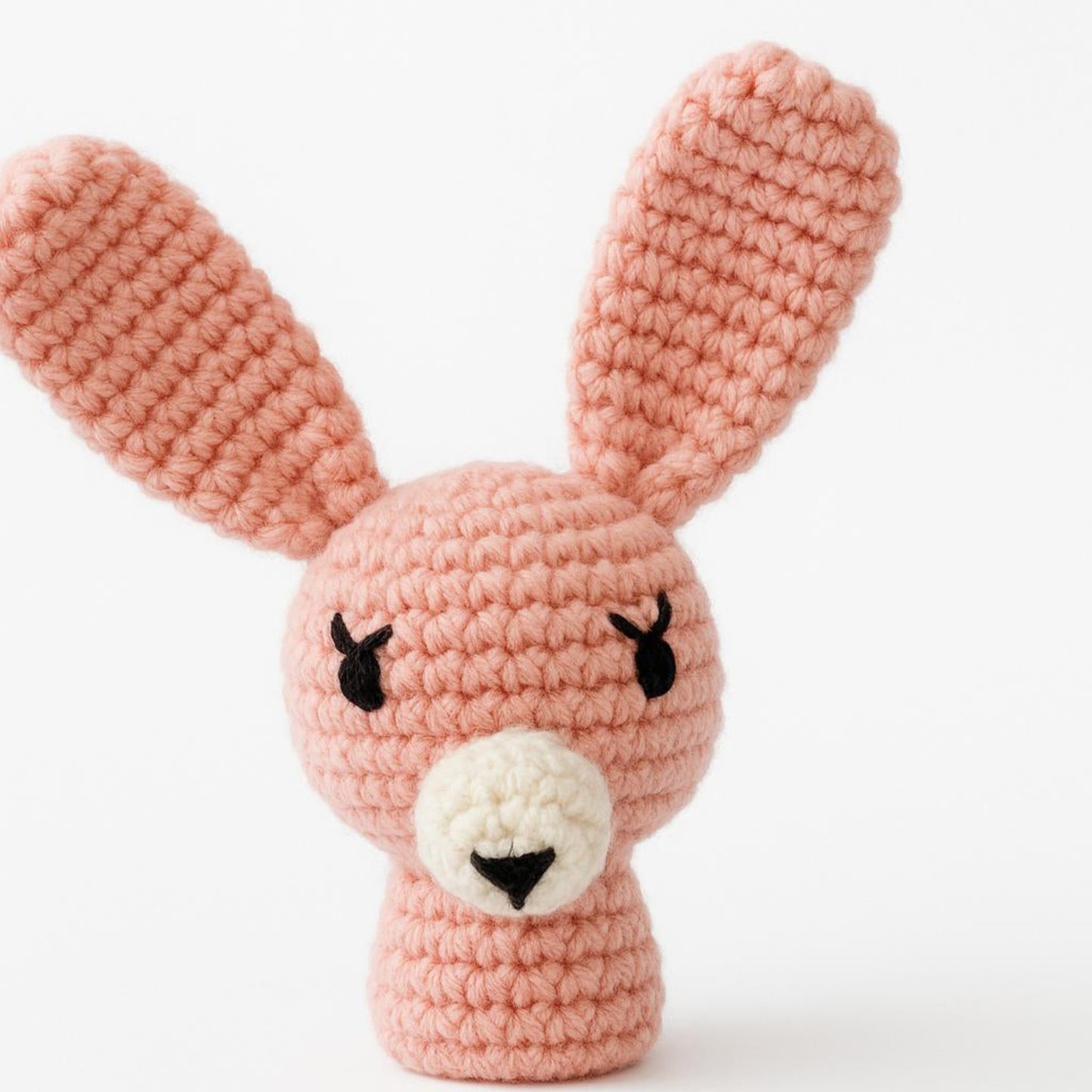 Crochet rabbit amigurumi face detail pink handmade embroidered features artisan