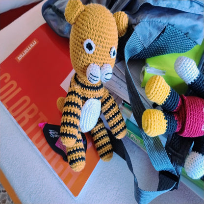 Amigurumi tiger stuffed animal with travel backpack and guidebook, portable handmade plush toy perfect companion gift for adventures
