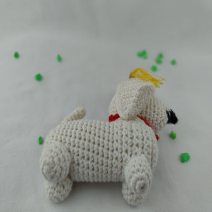 Handmade crochet graduation dog amigurumi side view showing detailed stitching