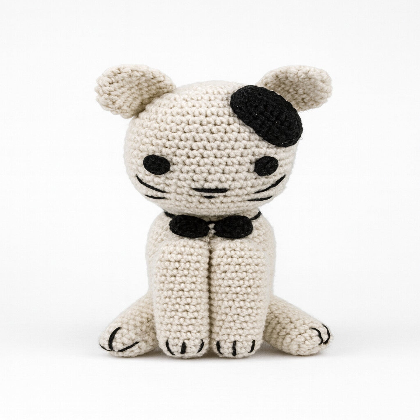 Main front view of a sitting handmade amigurumi cat with large safety eyes