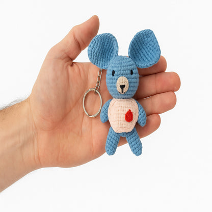 Close-up of a handmade koala amigurumi held in hand as keyholder to show intricate crochet details and soft yarn texture, made in Italy