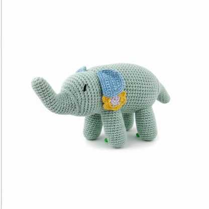Mint green crochet elephant plush with a yellow flower detail