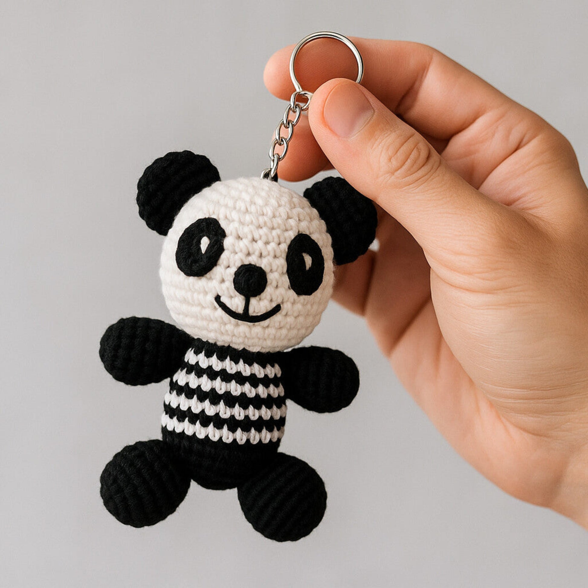 Handmade crochet panda amigurumi keychain with metal clasp and premium yarn
